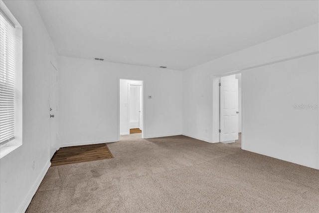 spare room featuring carpet flooring