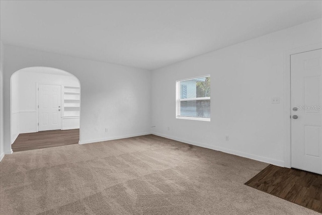 unfurnished room with carpet floors