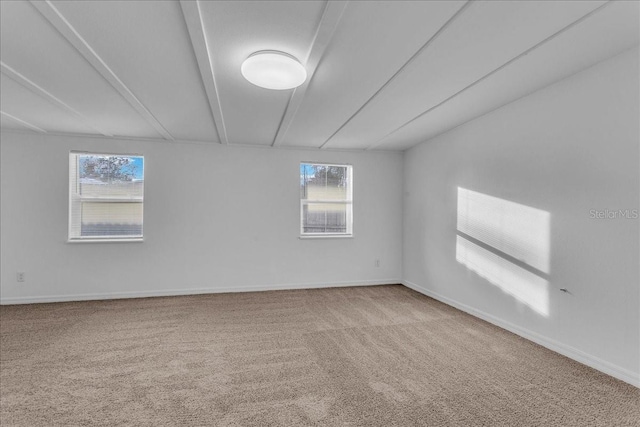 unfurnished room with carpet floors