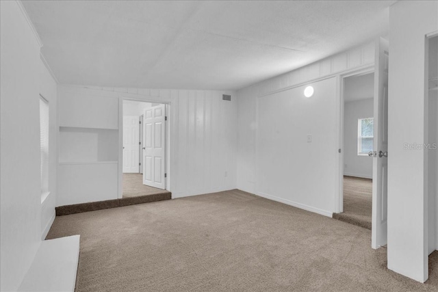 unfurnished room with carpet flooring