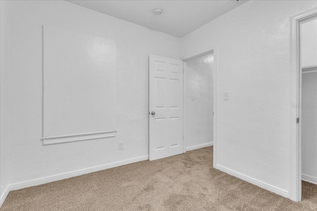 unfurnished bedroom with light carpet