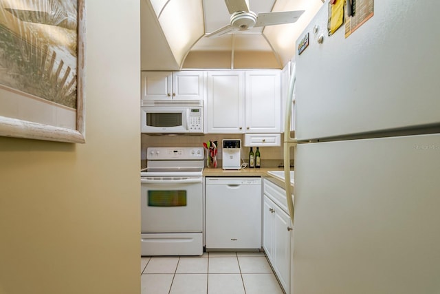 kitchen featuring white cabinets, ceiling fan, white appliances, and light tile patterned flooring