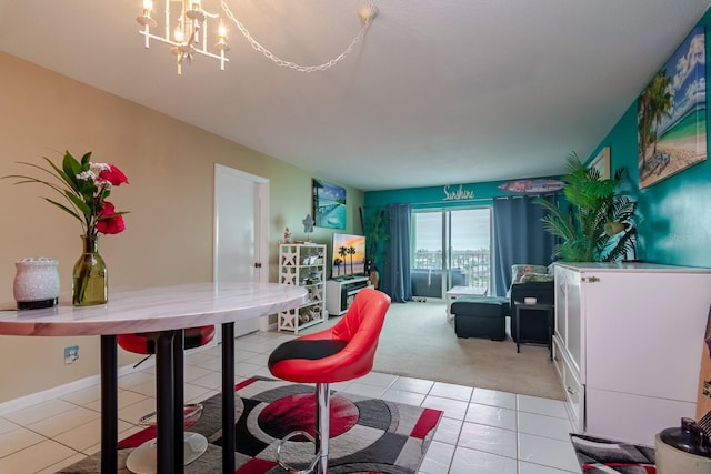 dining room featuring light carpet and a notable chandelier