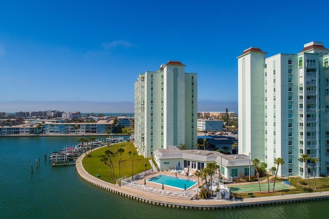 exterior space with a water view and a city view