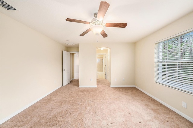 unfurnished bedroom with light colored carpet and ceiling fan