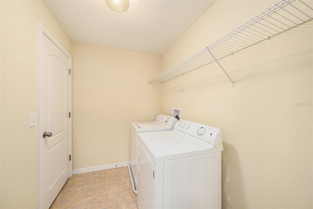 washroom with independent washer and dryer