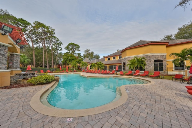 view of swimming pool featuring a patio area