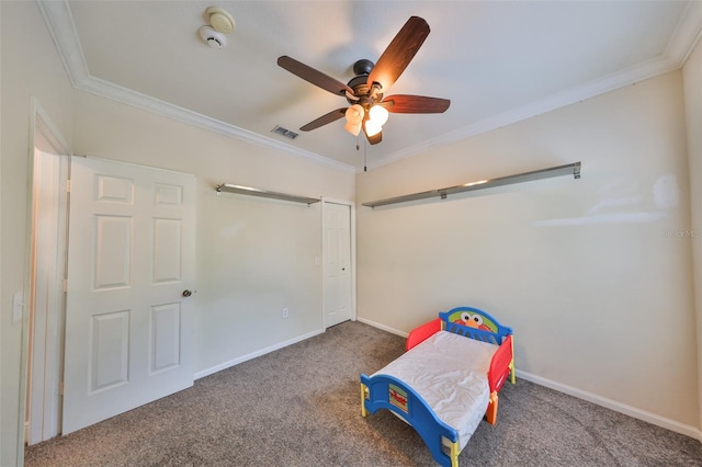 playroom with carpet, ceiling fan, and crown molding