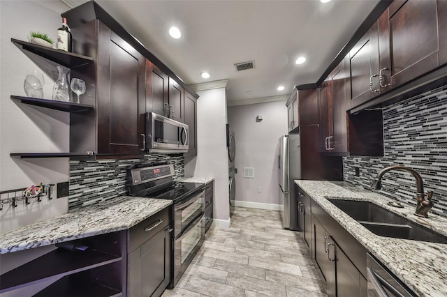 2160 Chianti Pl Unit 11-0117, Palm Harbor, FL 34683 - kitchen with a sink, visible vents, crown molding, open shelves, and appliances with stainless steel finishes