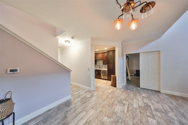 2160 Chianti Pl Unit 11-0117, Palm Harbor, FL 34683 - unfurnished living room with light wood finished floors, baseboards, a chandelier, and crown molding