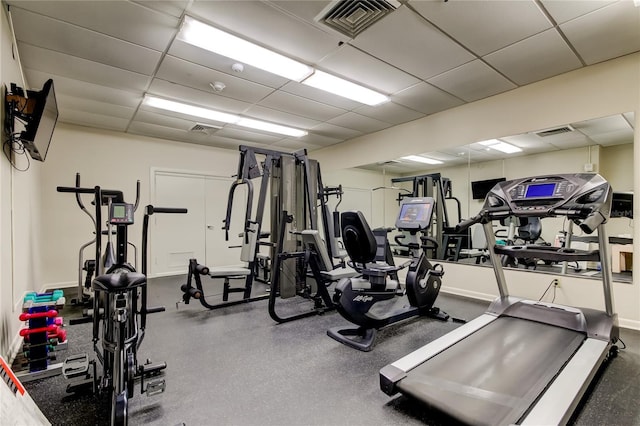 workout area featuring a paneled ceiling