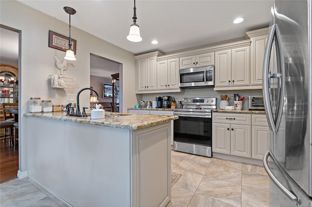 kitchen with appliances with stainless steel finishes, sink, hanging light fixtures, kitchen peninsula, and light stone counters