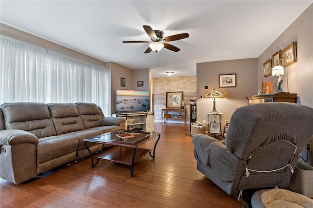 living room with ceiling fan and hardwood / wood-style flooring