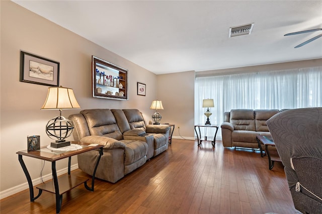 living room with ceiling fan and hardwood / wood-style floors