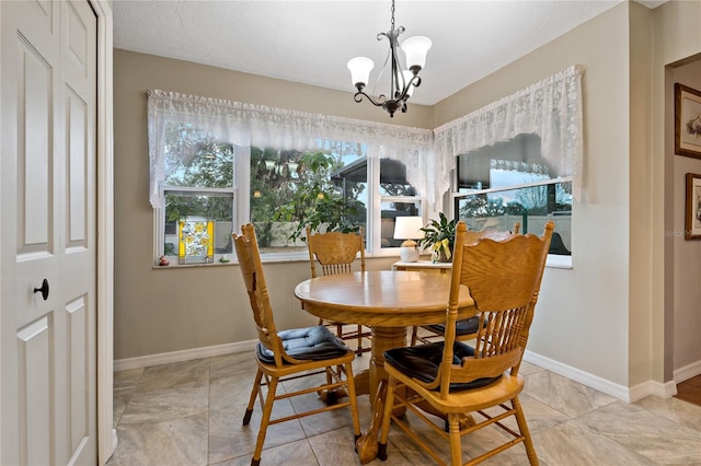 dining area with a chandelier