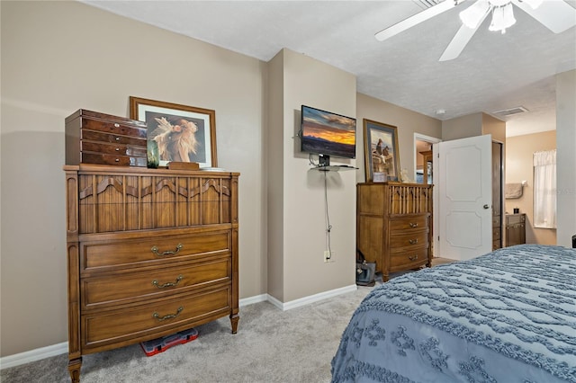 bedroom with ceiling fan and light colored carpet