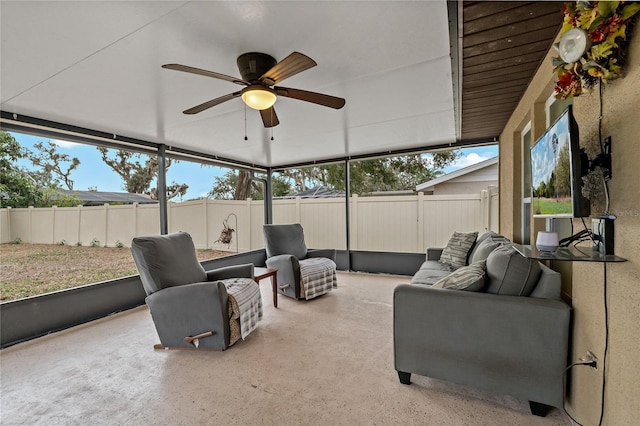 sunroom featuring ceiling fan and a wealth of natural light