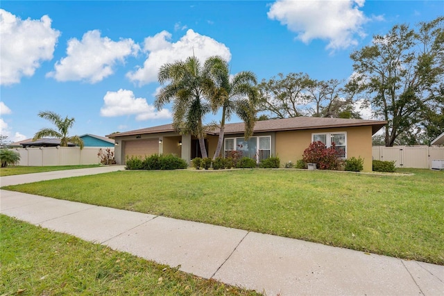 single story home featuring a front lawn and a garage