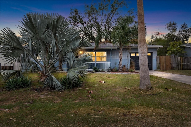 view of front facade featuring a yard and a garage