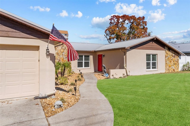 ranch-style house featuring stucco siding and a front yard
