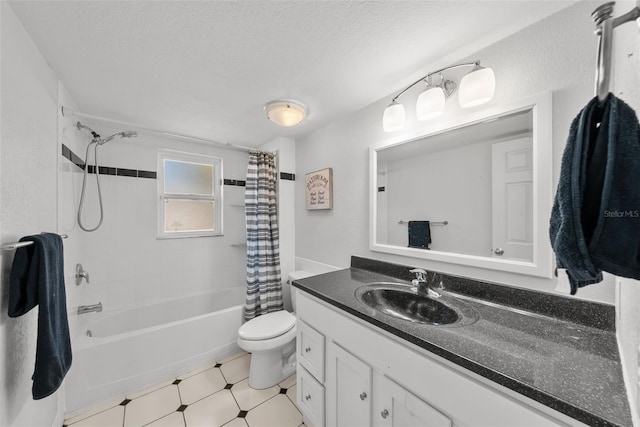 full bath with shower / bath combo, toilet, vanity, and a textured ceiling