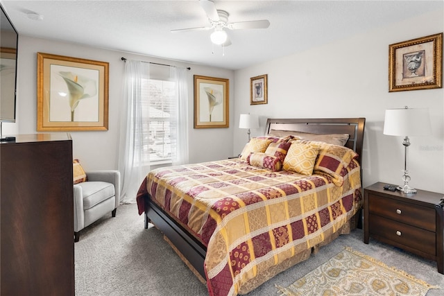 bedroom with ceiling fan and carpet