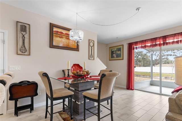 dining area featuring a chandelier