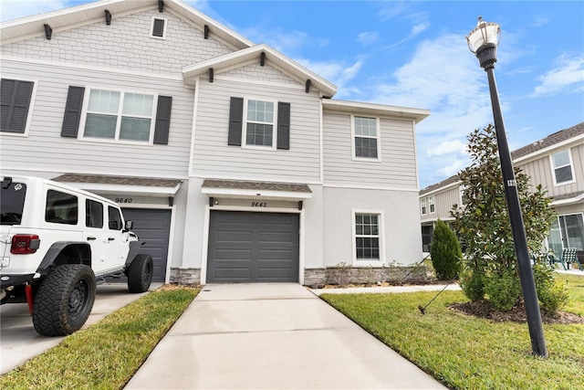 view of front of home with a garage and a front yard