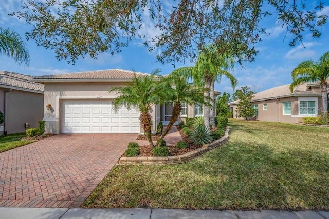 view of front facade with a garage and a front yard