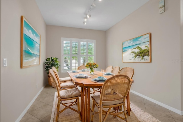 tiled dining room with track lighting