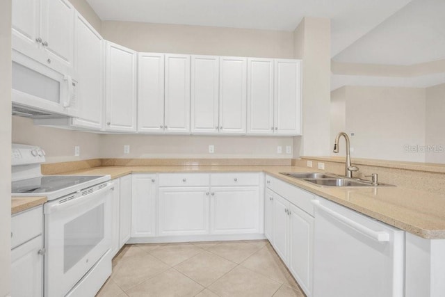 kitchen featuring white cabinetry, white appliances, kitchen peninsula, and sink