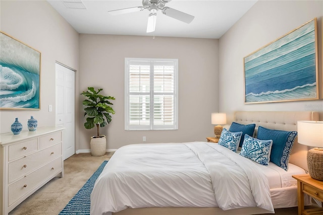 carpeted bedroom with ceiling fan