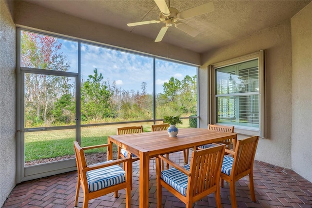 sunroom / solarium with ceiling fan