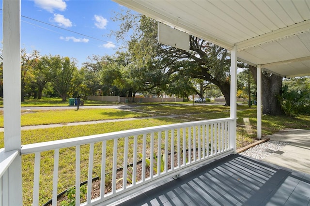 wooden terrace with a yard