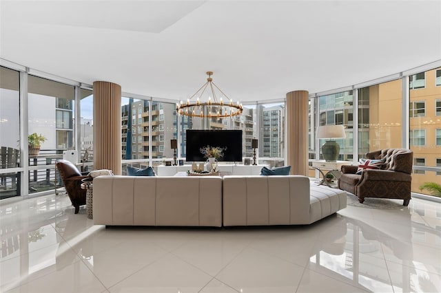 tiled living room with a wall of windows and an inviting chandelier