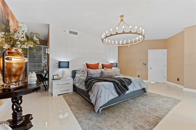 bedroom with a chandelier and light tile patterned flooring