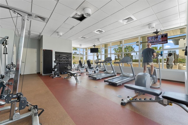 workout area with a paneled ceiling