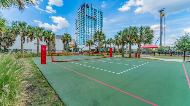 view of property's community with tennis court