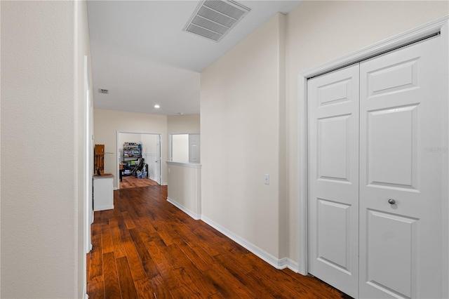 hallway featuring dark wood-type flooring