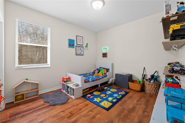 bedroom with wood-type flooring