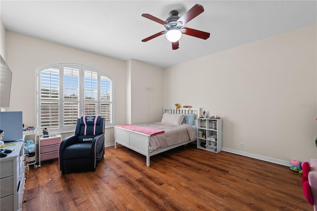 bedroom featuring dark wood-type flooring and ceiling fan