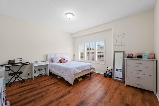 bedroom featuring dark hardwood / wood-style flooring