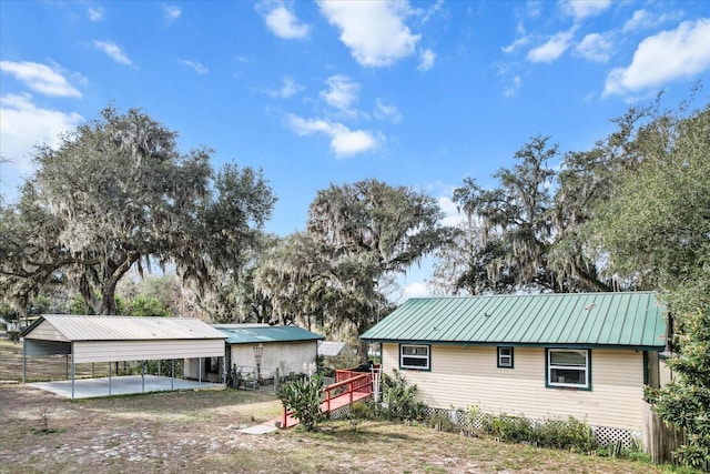 view of property exterior featuring a carport