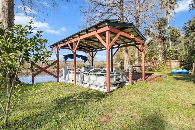 dock area featuring a lawn and a water view