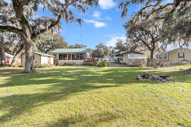 view of yard featuring a sunroom