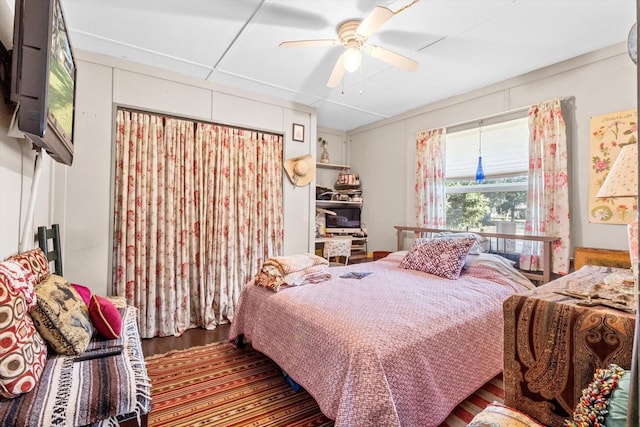 bedroom featuring ceiling fan and hardwood / wood-style floors