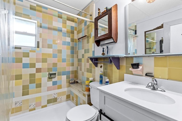 bathroom with toilet, vanity, backsplash, and walk in shower