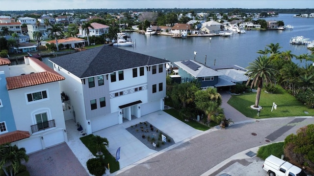 birds eye view of property featuring a water view