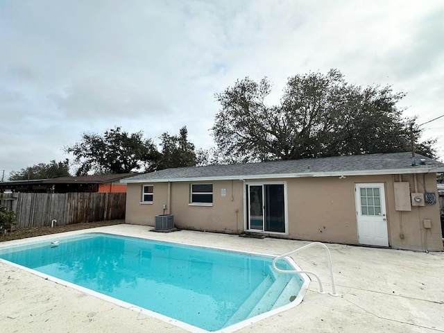 view of pool with central AC unit