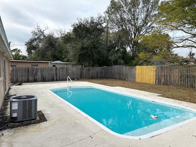 view of pool featuring a patio area and central AC